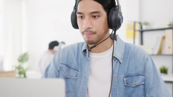 Happy asia girl gamer wear headphone competition play video game online  with smartphone. Stock Photo by Tirachard