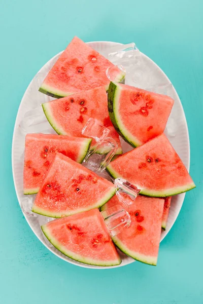 Closeup Fresh Cut Watermelon Slices Ice Cubes Plate Blue Background — Stock Photo, Image