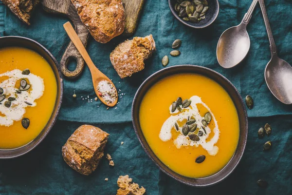 Autumn Food Pumpkin Soup Cream Seeds Bowls Table Served Dinner — Stock Photo, Image