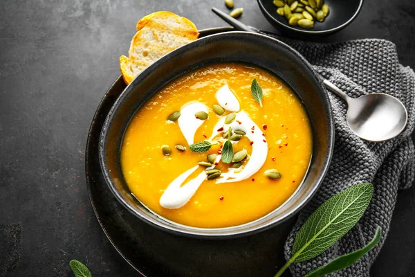 Pumpkin creamy soup served in bowl — Stock Image Pumpkin creamy soup served in bowl Stock Image