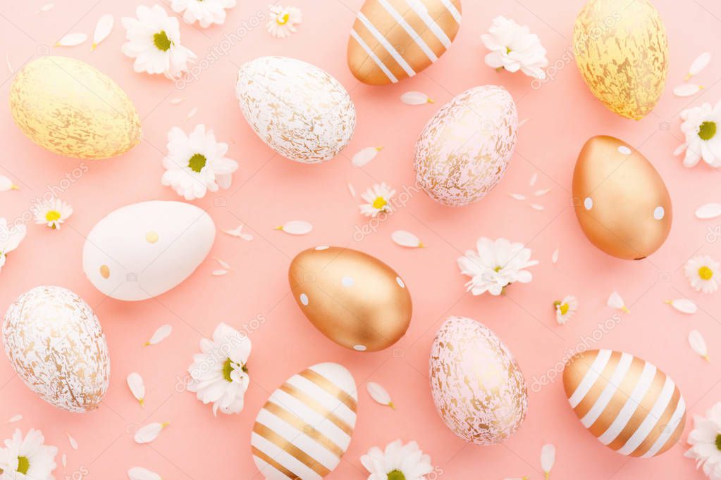 Easter Flat Lay of Eggs with flowers on pink