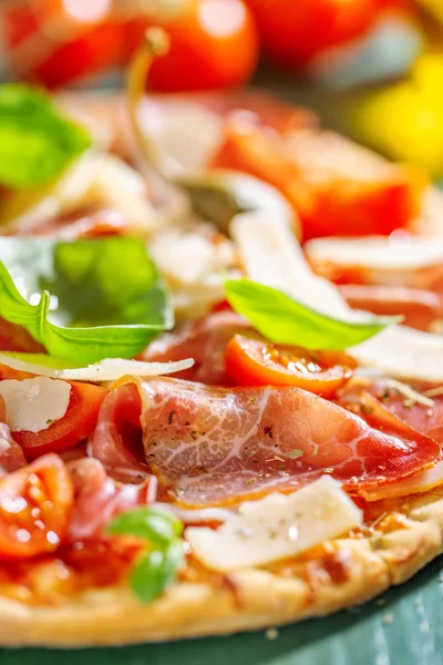 Appetizing italian pizza with prosciutto — Stock Photo, Image