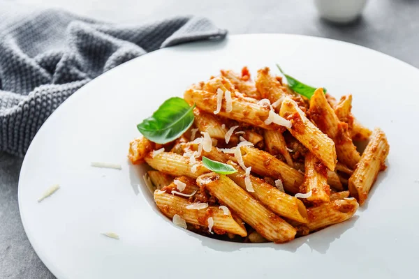 Bolognese penne pasta served on plate — Stock Photo, Image