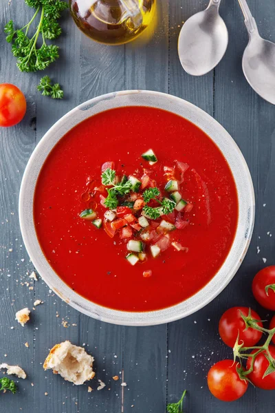Tasty summer tomato soup served in bowl — Stock Image Tasty summer tomato soup served in bowl Royalty Free Stock Photos