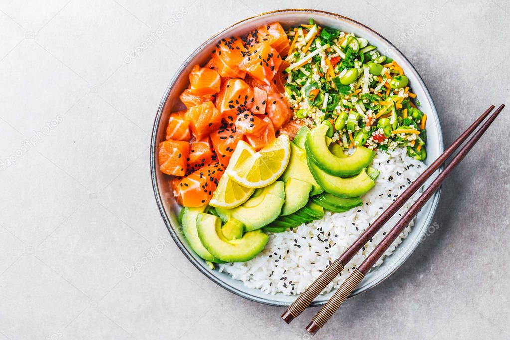 Poke bowl with salmon served in bowl