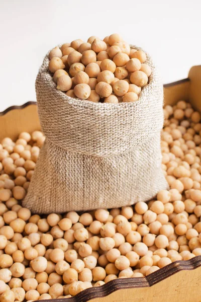 dry raw chickpeas in a burlap bag