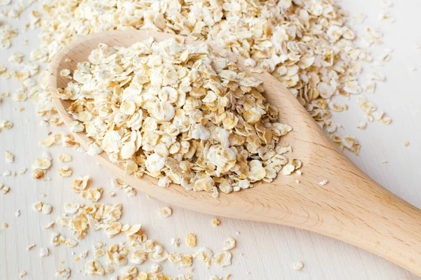 Rolled oats in a big spoon — Stock Photo, Image