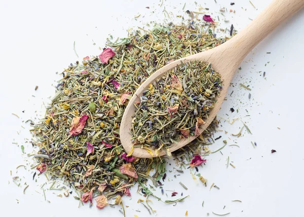 Dry herbal tea in wooden spoon — Stock Photo, Image
