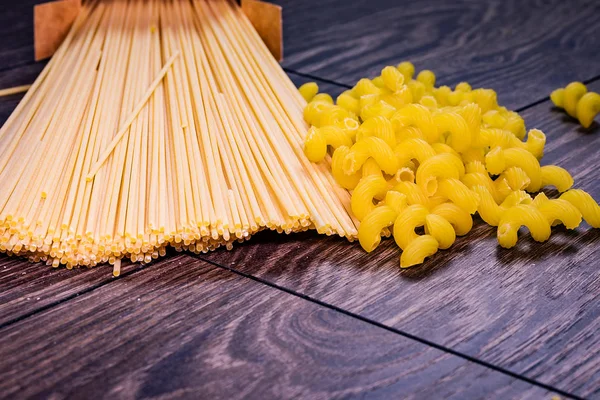 Pasta from the pack on the table scattered.