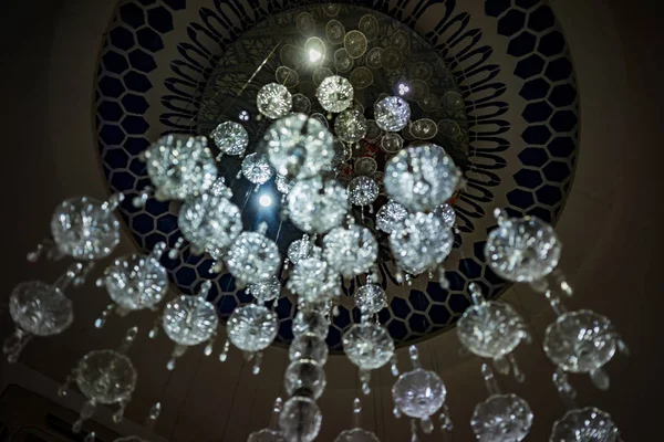 Beautiful crystal chandelier, bottom view. View of the chandelier made of crystal from the bottom not normally.