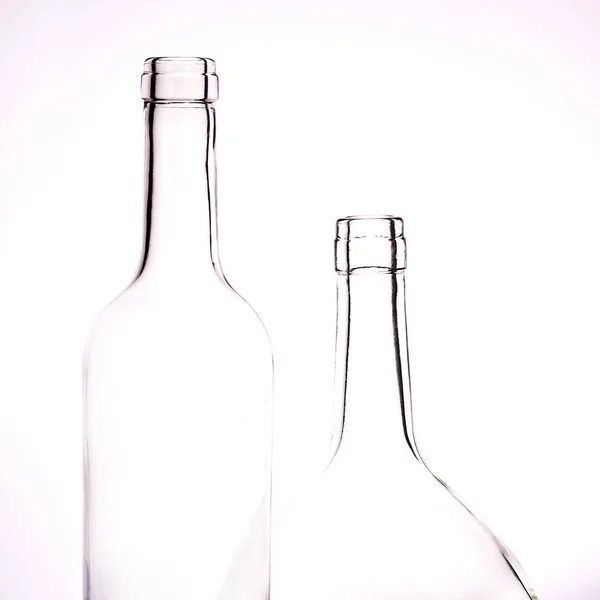 Dos Botellas Vidrio Transparente Diferente Tamaño Sobre Fondo Blanco — Foto de Stock