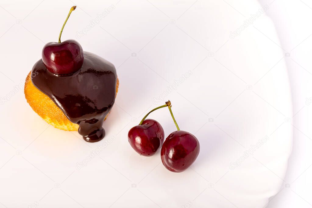 Homemade cupcakes with cherries and chocolate. Classic dessert. Cooking dessert at home.
