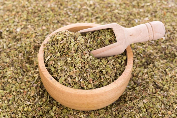 Dried Oregano in wooden bowl — Stock Photo, Image