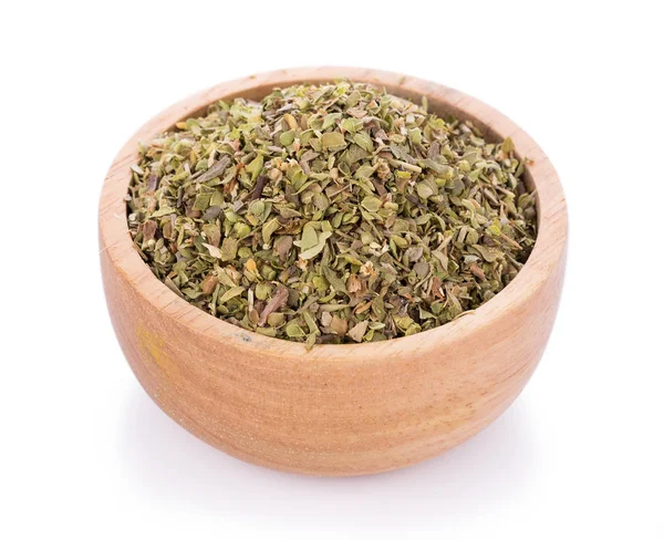 Dried Oregano in wooden bowl on white background — Stock Photo, Image