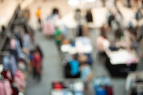 Blur image of Shopping mall or exhibition hall and people for ba