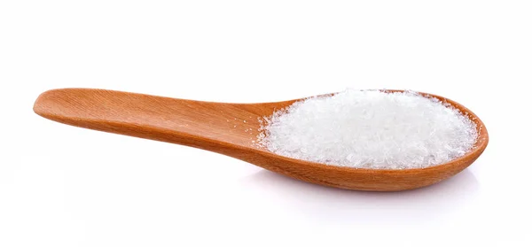 Sea salt on wooden spoon isolated on white background — Stock Photo, Image