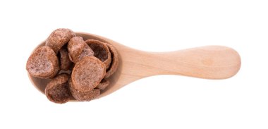 chocolate cereals in spoon on white background. Cornflakes