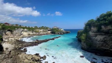 view of the beach with the waves in the sea