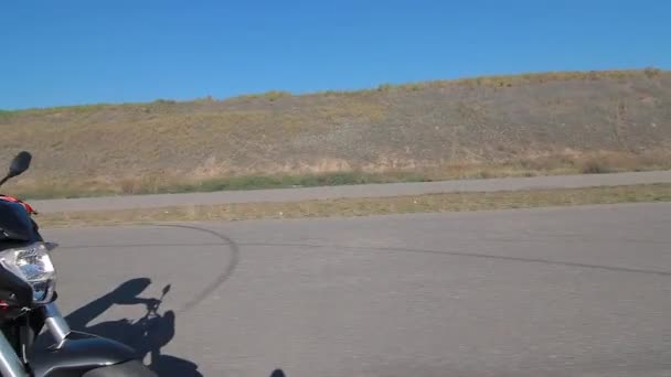 Motorcyclist Rides Road — Stock Video