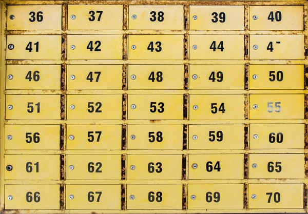Small yellow lockers of po boxes outside a post office at Kyrenia, Cyprus