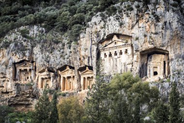 Rock tombs of the kings at ancient city of Kaunos, a UNESCO world heritage site at Dalyan, Mugla, Turkey clipart
