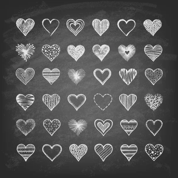 Set of drawn hearts on a chalkboard. — Stock Vector