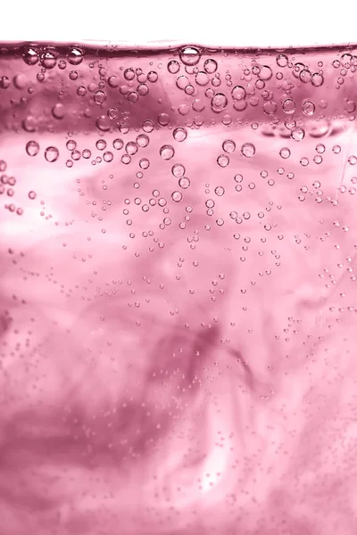 Agua rosada, aire y aceite mezclados para un efecto burbujeante — Foto de Stock