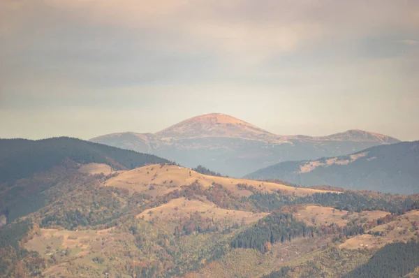 Mountains in a blue haze in autumn afternoon