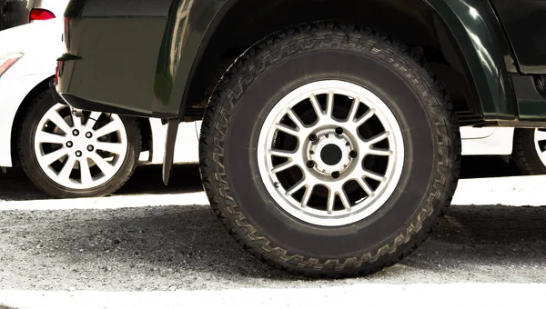 All-season tire on wheel rim