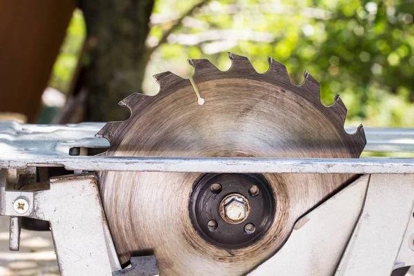 Electric saw table tool for woodwork with free space. Workshop with nobody