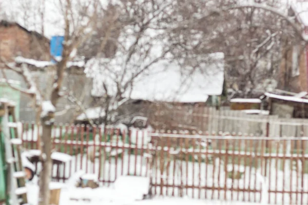 Rozmazané Pozadí Sněhu Zimní Vesnice Malé Domy Stromy — Stock fotografie