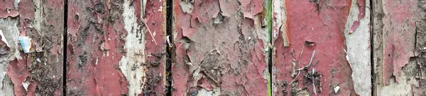 banner of Old wooden background with remains of pieces of scraps of old paint on wood