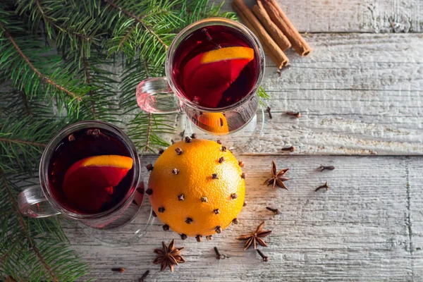 Christmas hot mulled wine with cinnamon orange and anise on white wooden background — Stock Photo, Image