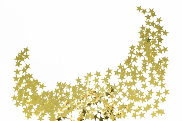 Christmas corner with gold star confetti. Holiday background for New Year on white with copyspace