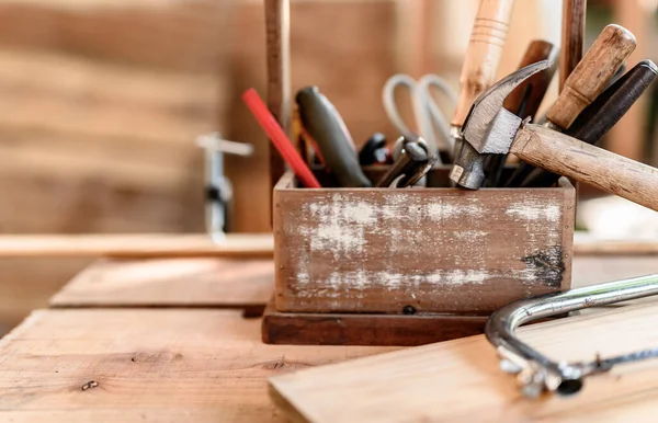 Carpenter working in carpentry shop. Woodwork for furniture and home decor making concept. DIY wood for decoration.