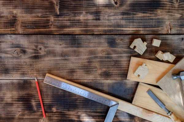 Vintage woodworking equipment for DIY and work tools for carpenter and craftsmanship. Labor day concept with flat lay wood background.