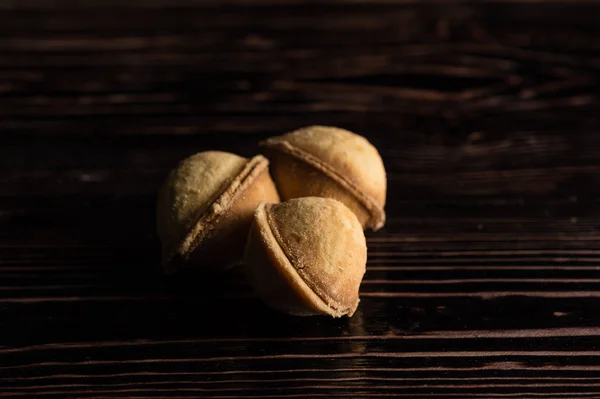 Cookies in the form of a walnut with boiled condensed milk — Stock Photo, Image