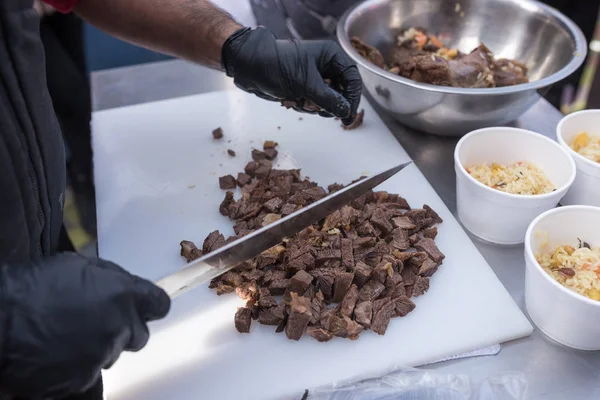 Chef cooks sheep meat