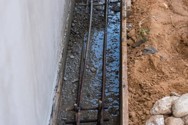 Armature in the formwork for the foundation. Building construction