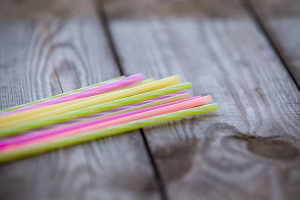 Plastic straws on wooden background plastic free concept