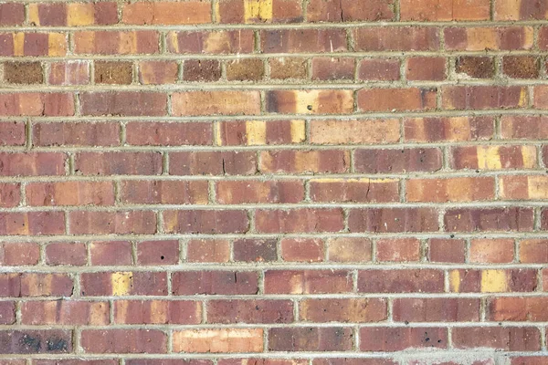 Variegated colors of brick and mortar wall