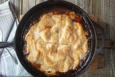 Golden Crusted Apple Pie Made In A Cast Iron Skillet clipart