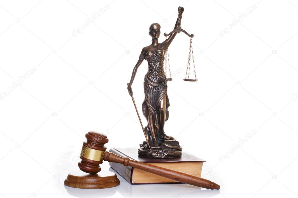 statue of justice, judges hammer behind books on a white background