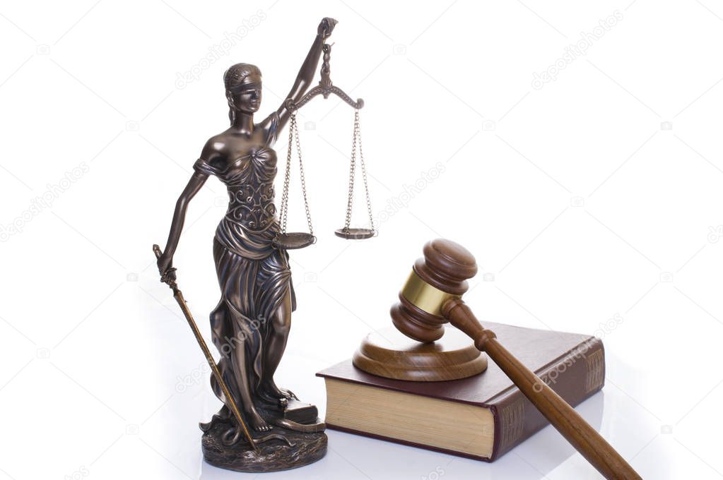 statue of justice, judges hammer behind books on a white background