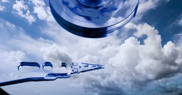 Hard disk drive with reflected in it the time-lapse of clouds, the concept of cloud storage, video loop — Stock Video