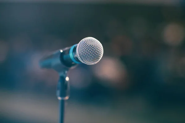 Classic microphone, vintage edition, blurred auditorium