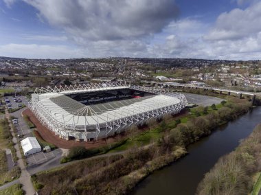 Editorial Swansea, UK - March 17, 2019: Aerial view of The Liberty Stadium in Swansea, a premier venue for conference and events in and also the home to Swansea City Football Club and Ospreys rugby. clipart