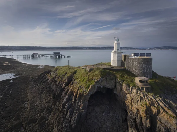 Mumbles Lighthouse, pier and Bob\'s caveBob\'s Cave is found at the tip of Mumbles Head under the lighthouse, it\'s named after a member of the Mumbles Lifeboat crew, Bob Jenkins, who sheltered here two days after a tragic rescue attempt in January 188