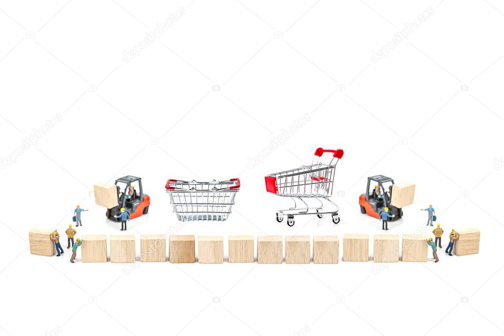 Miniature worker with wood block and shopping basket , shopping cart isolated on white background ,  Image for online shopping and delivery  concept.