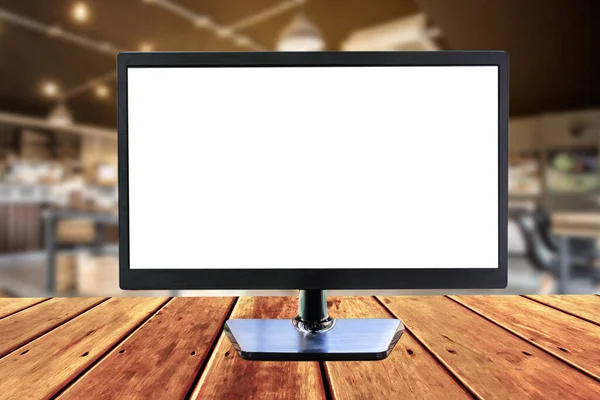 blank monitor for your advertisement design on wooden table